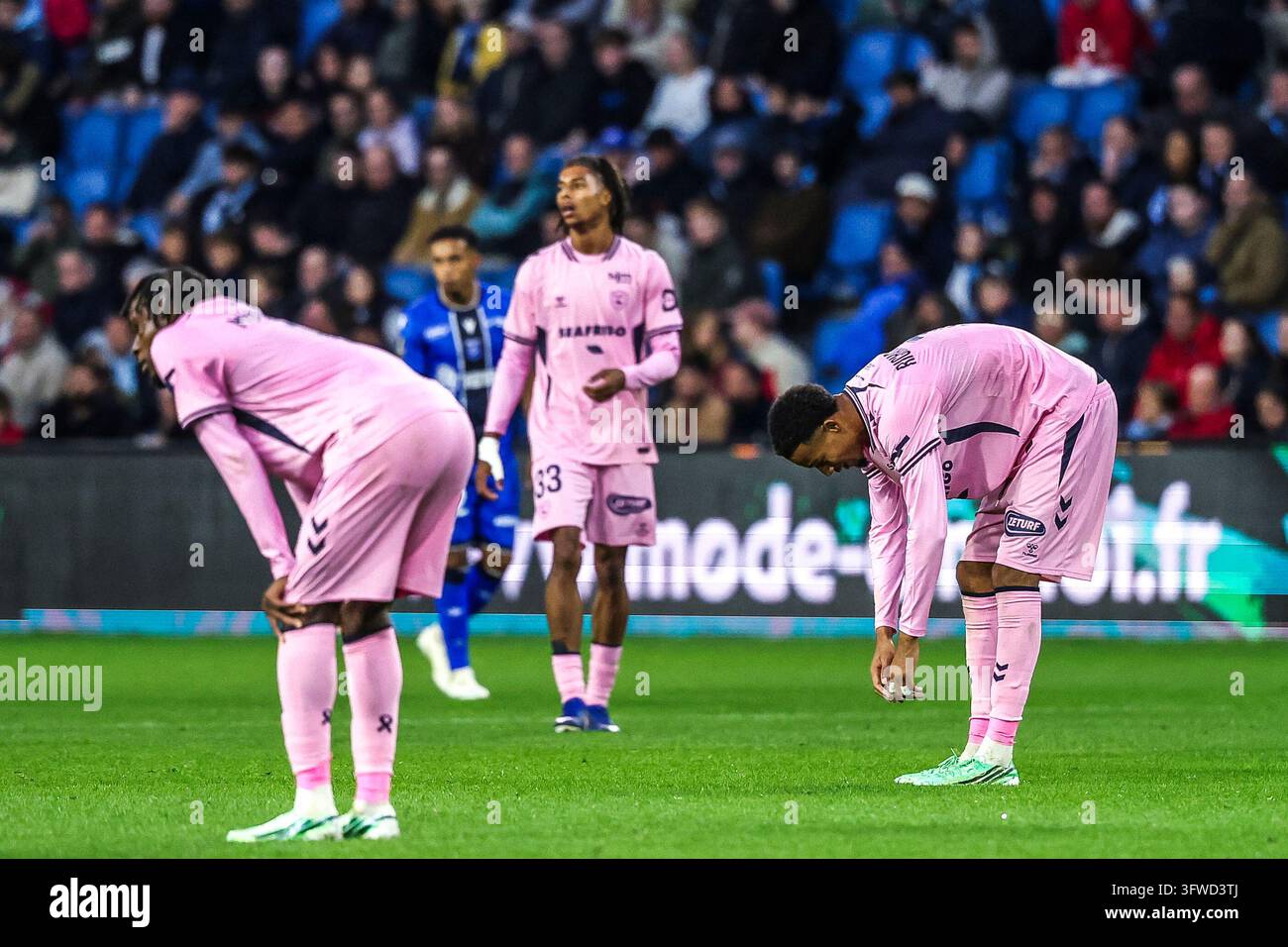 Junior MWANGA and Amir RICHARDSON of Le Havre AC looks dejected during ...