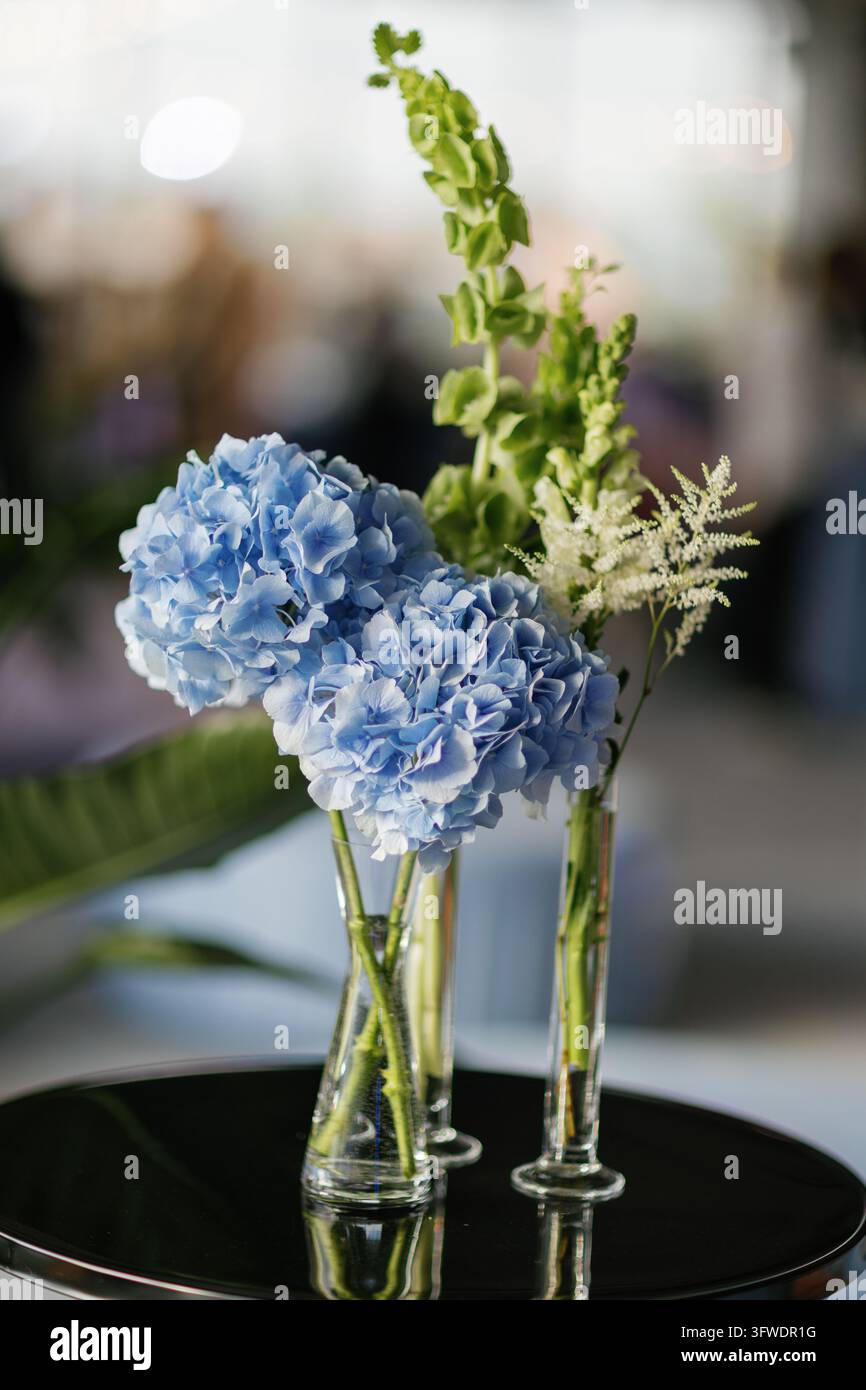 Hydrangeas with green bells of Ireland and white astilbe creating a ...