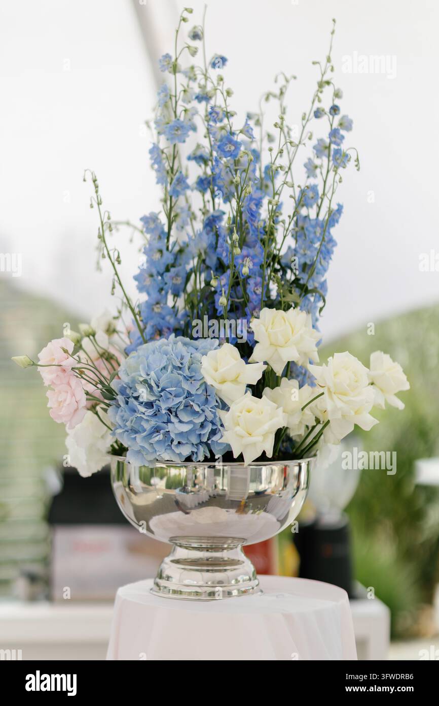 Colorful floral arrangement with blue delphinium, hydrangea, pink ...