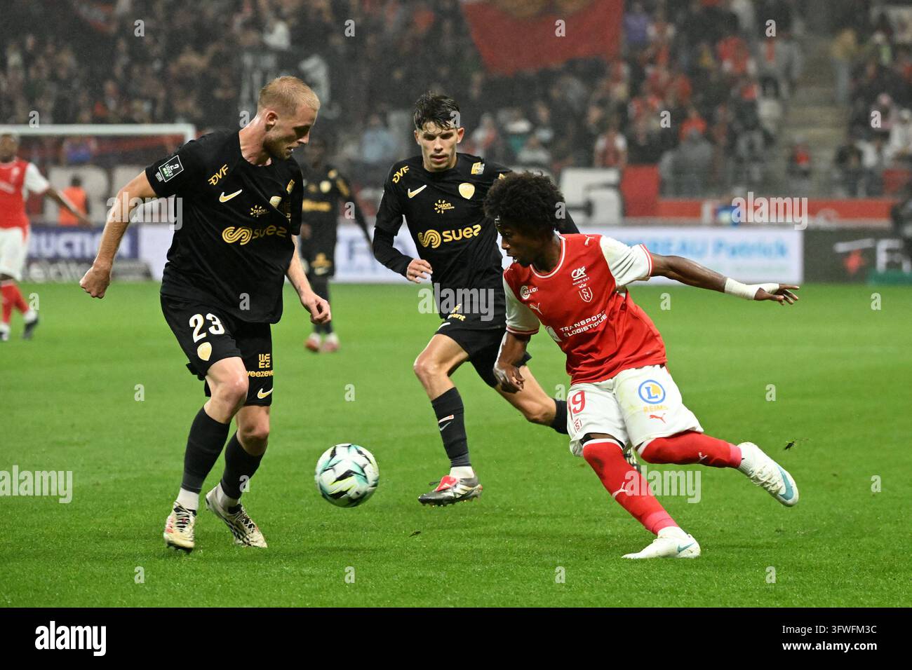Arone GADOU of Reims and Lenny LACROIX of Dijon during Ligue 2 BKT ...