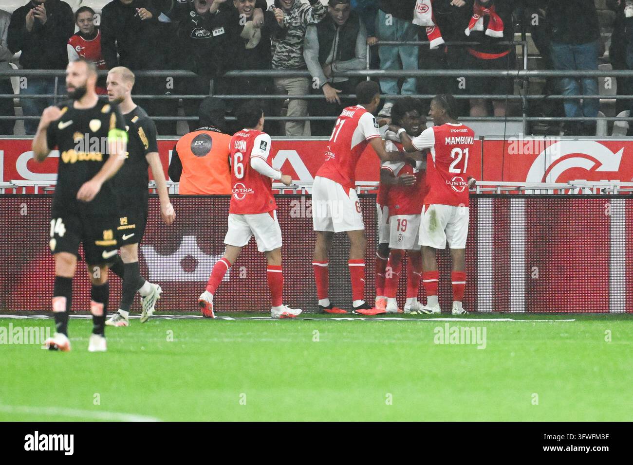 Arone Gadou of Reims and players celebrate after a goal during Ligue 2 ...