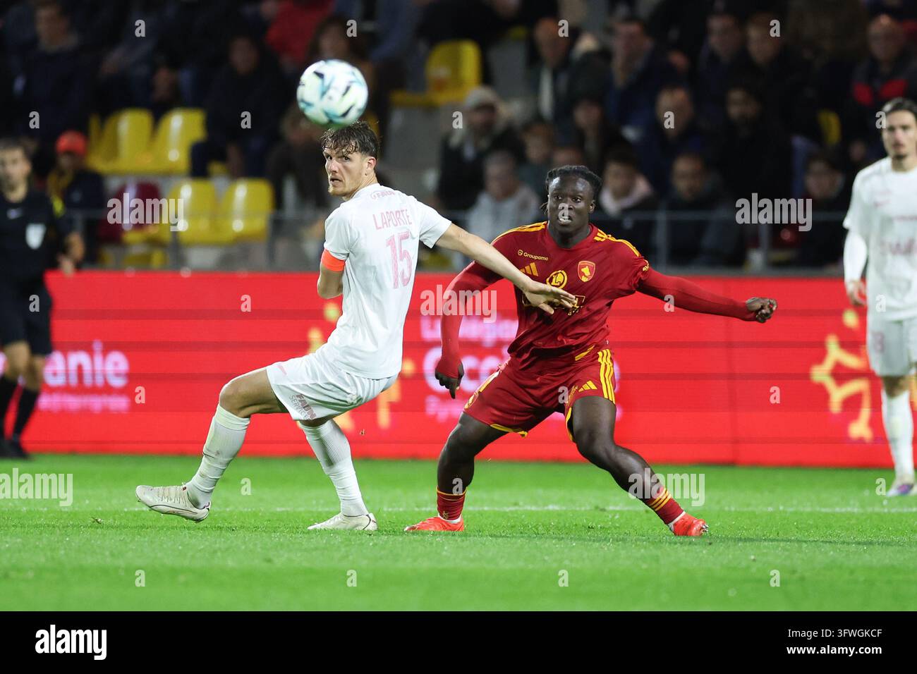 Julien LAPORTE of Montpellier HSC and Mathis Touho of Rodez during ...