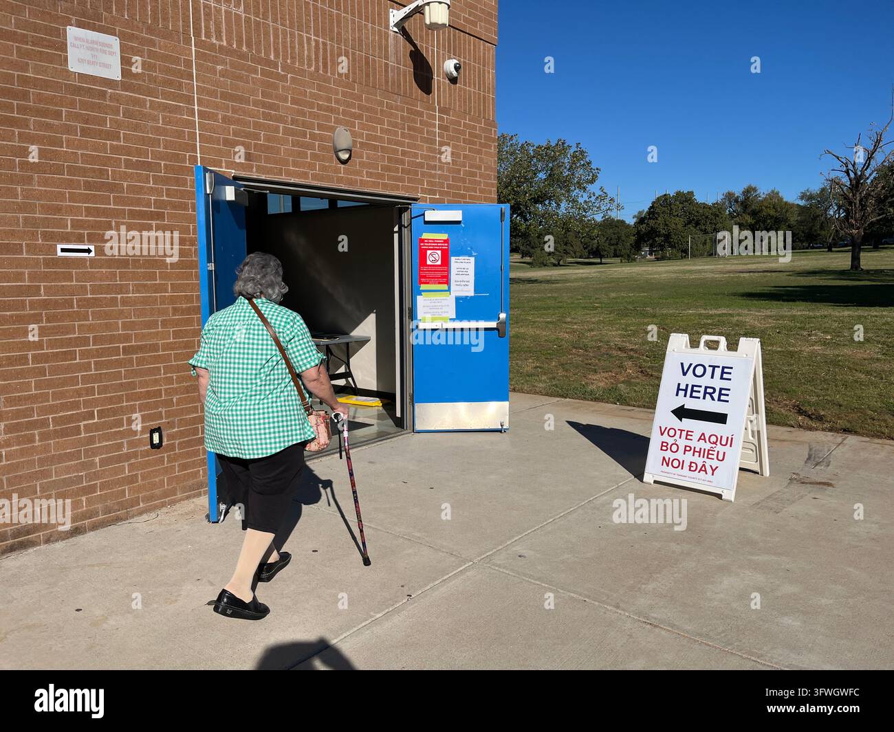 Woman walking in to cast her vote at Handley community center, Tarrant county, Texas, USA midterm election, governor, senator, - Smartphone Captured Stock Image