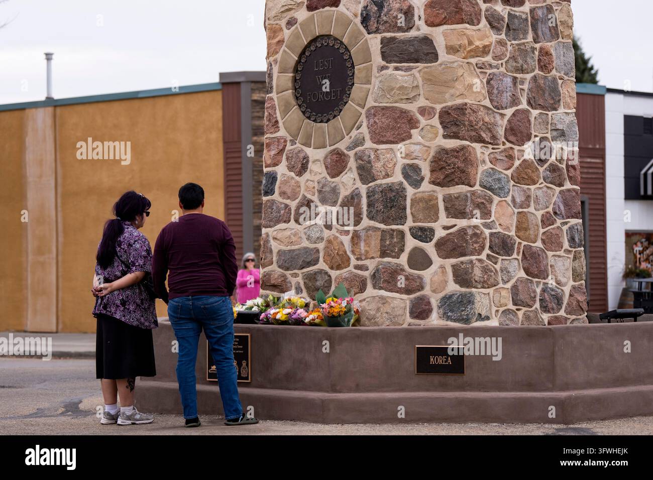 People pay their respects to the victims of a fire that killed four ...