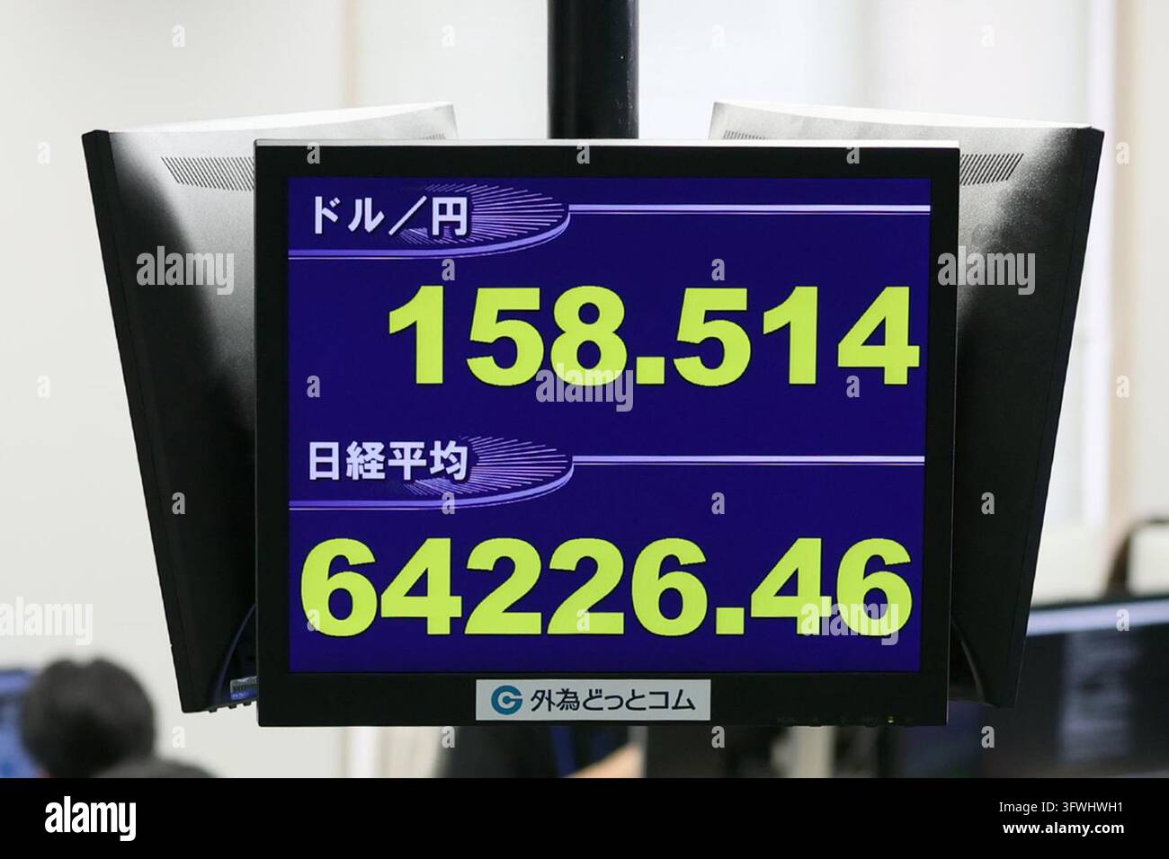 An electronic board displays the Japanese yen's exchange rate against ...