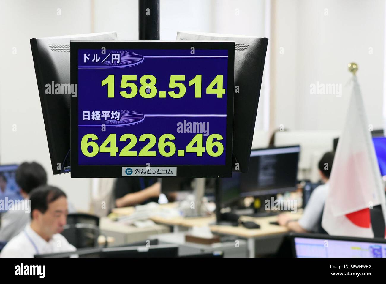 An electronic board displays the Japanese yen's exchange rate against ...