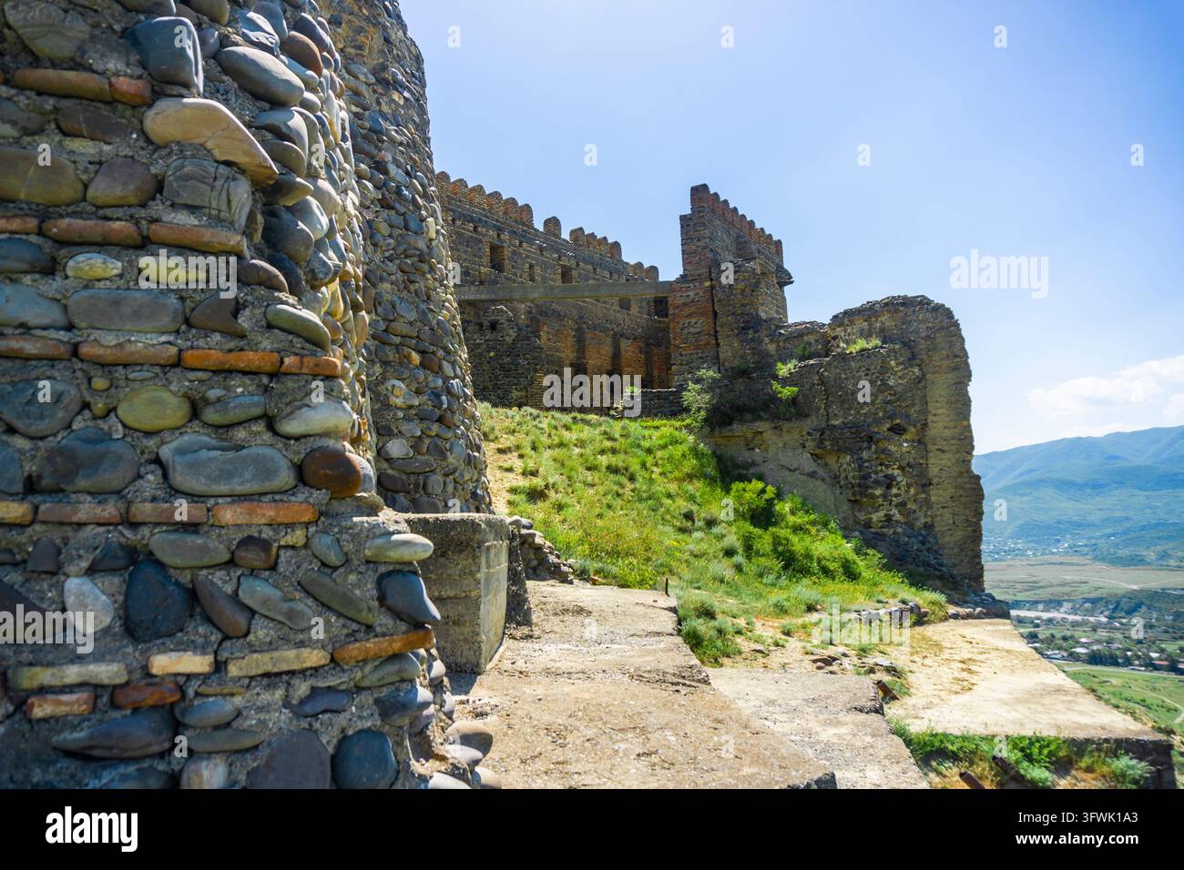 Vector Mike Old Partially destroyed stone wall of the old fortress of Ksani. Mountain ...