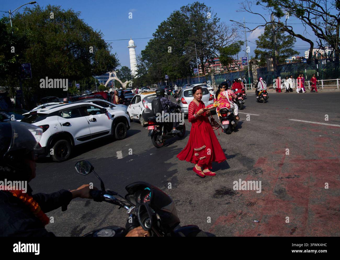 A devotee arrives carrying essential items for rituals during Nawami ...