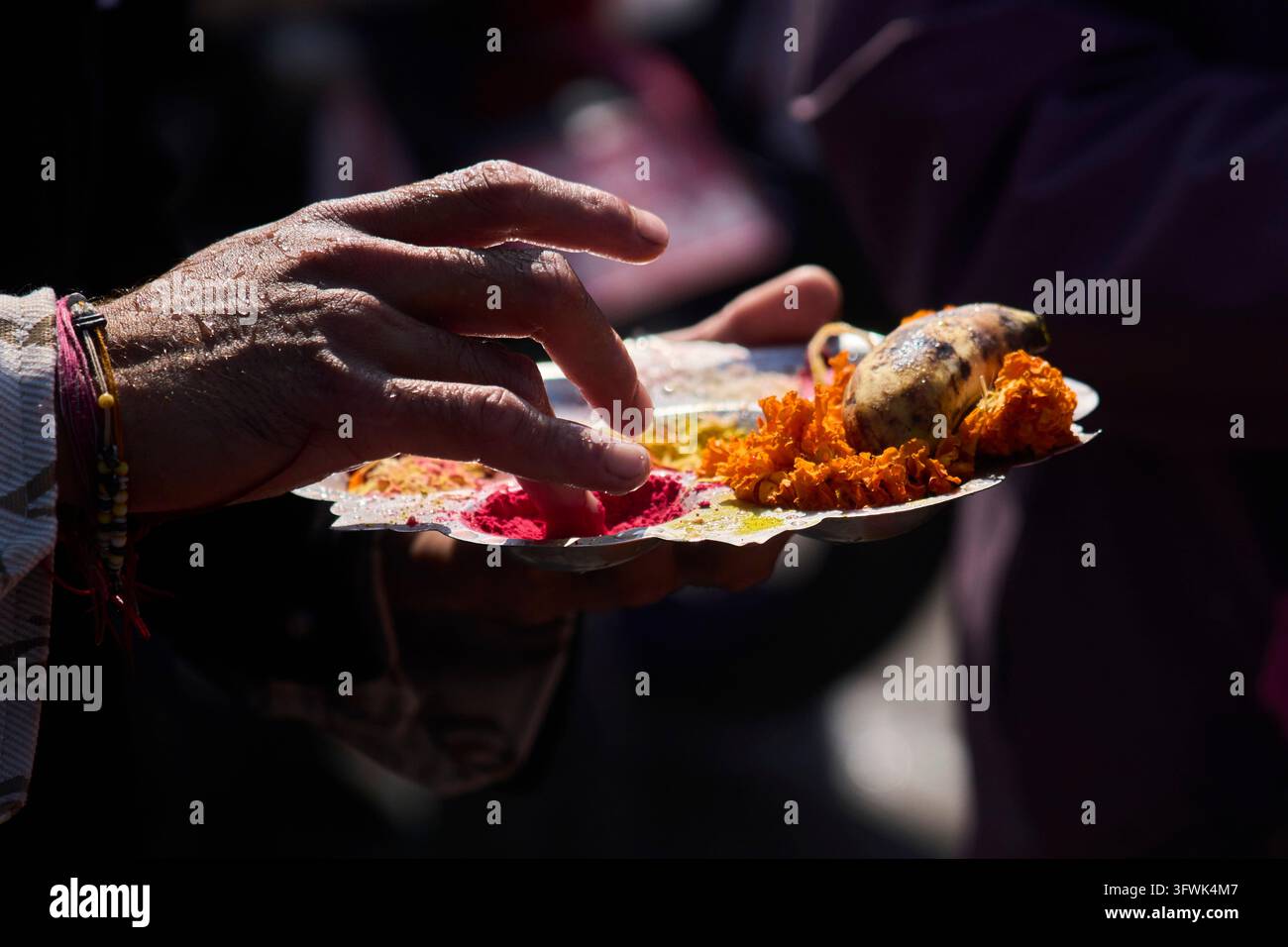 A devotee prepares essential items to perform rituals for his ...