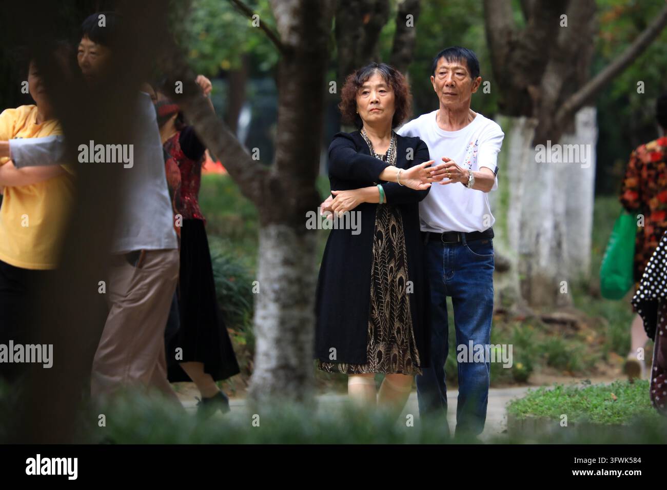 Residents exercise in a park in Huai'an, east China's Jiangsu province ...