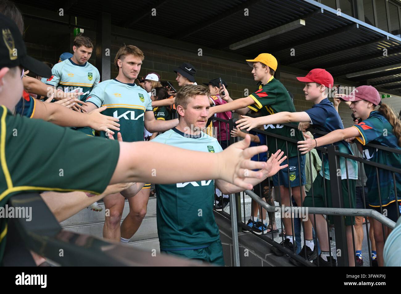Australian Rugby Teager Tom Dearden (right) is seen with fans during an Australian Kangaroos ...