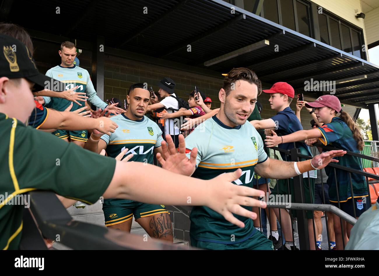 Australian Rugby Teager Cameron Murray (right) is seen with fans during an Australian Kangaroos ...