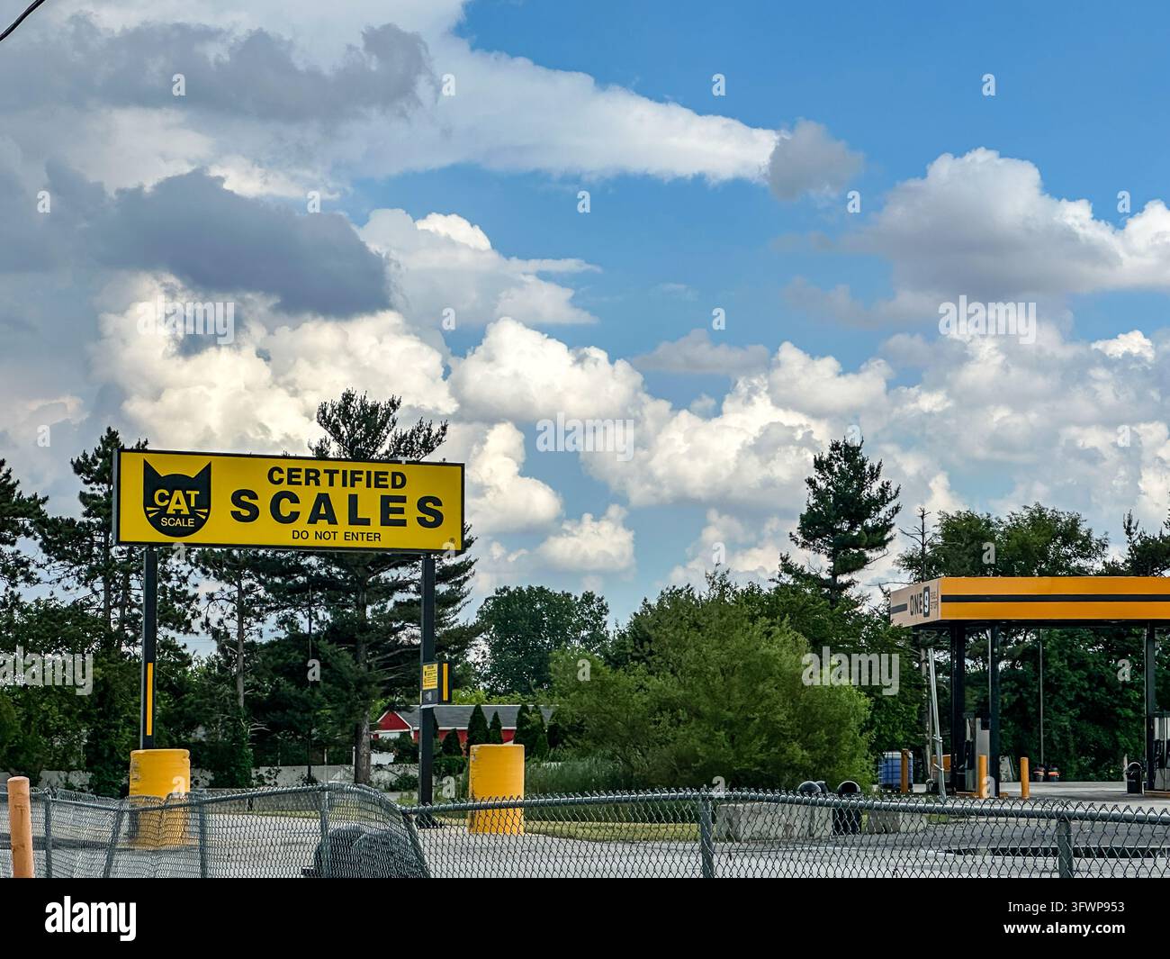Certified CAT Scale Sign at a Truck Stop Under a Dramatic Cloudy Blue Sky. Valparaiso, IN USA - June 8, 2026 - Smartphone Captured Stock Image