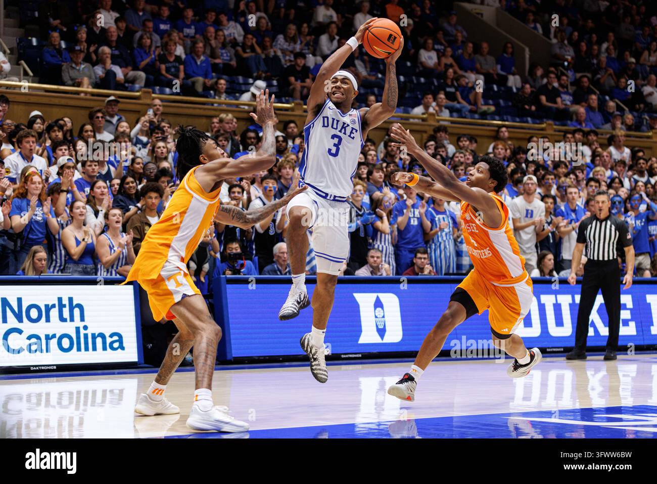 Ruby Rippey Photos Duke's Deron Rippey Jr. (3) drives between Tennessee's Juke Harris ...