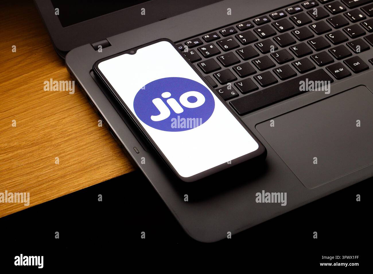 In this photo illustration, the Jio logo is seen displayed on a ...