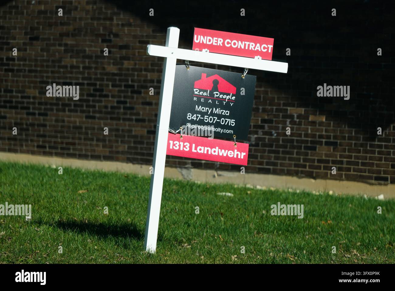 A under contract sign is displayed outside of a home in Northbrook, Ill ...