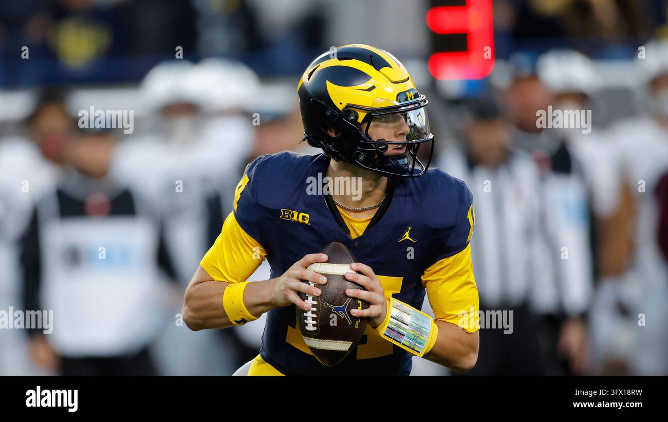 Michigan quarterback Tommy Carr plays during an NCAA football game on ...