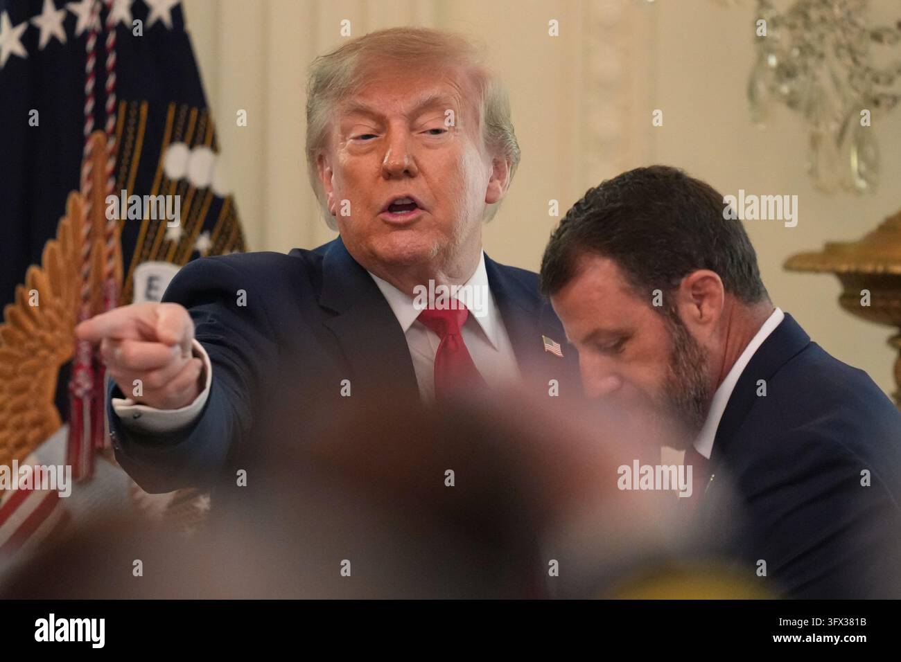 President Donald Trump gestures after speaking at a roundtable event in ...