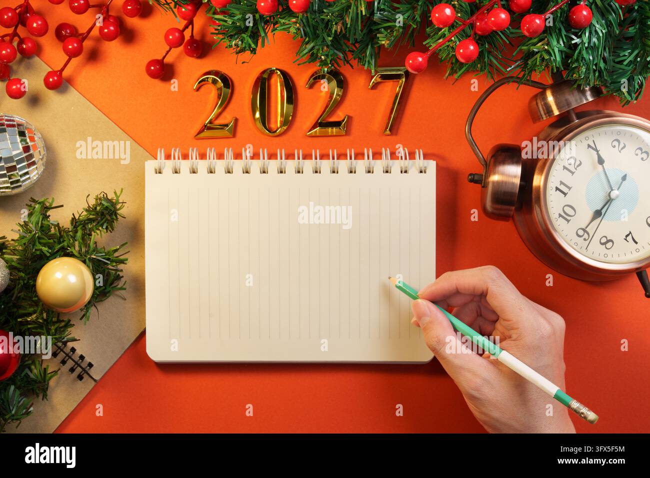 New Year planning with a notebook beside Christmas decorations Stock ...