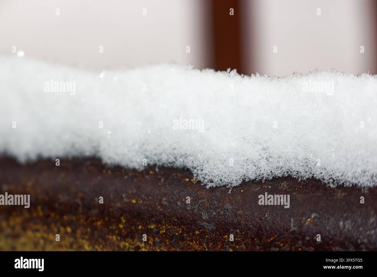 Whit Porch Railing Fluffy white snow rests on a rustic weathered railing, showcasing ...