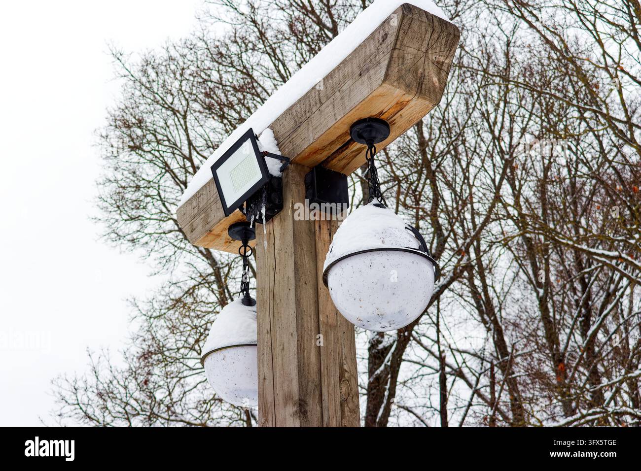 Classical Image Segmentation Rustic wooden street lamp post featuring modern led floodlight and ...