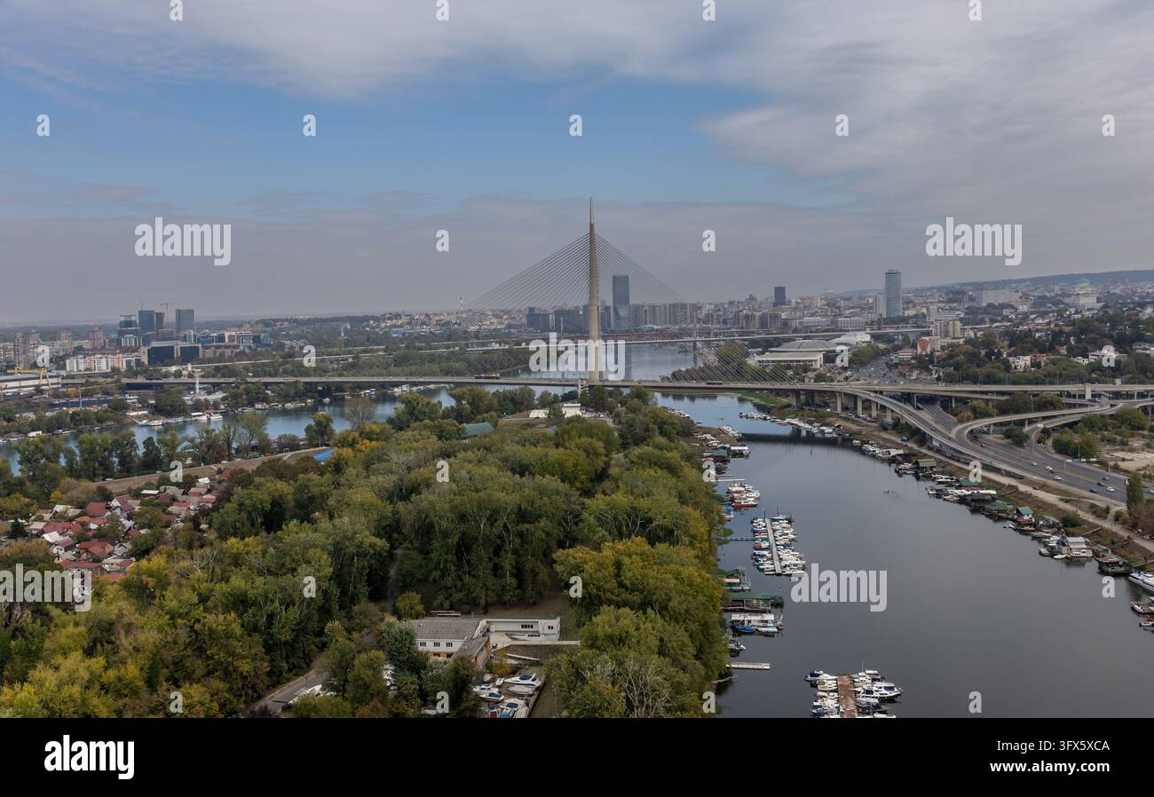 Urban Rivers Photography aerial view of belgrade skyline with modern ada bridge crossing sava ...