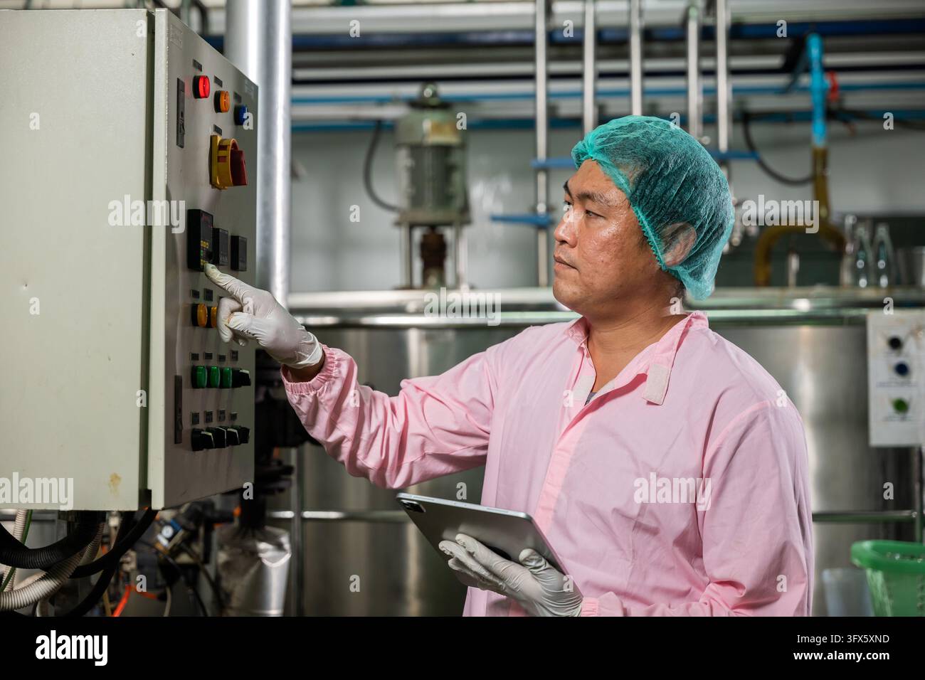 Factory Work Vector At beverages factory a worker with a tablet manages soda water filling ...