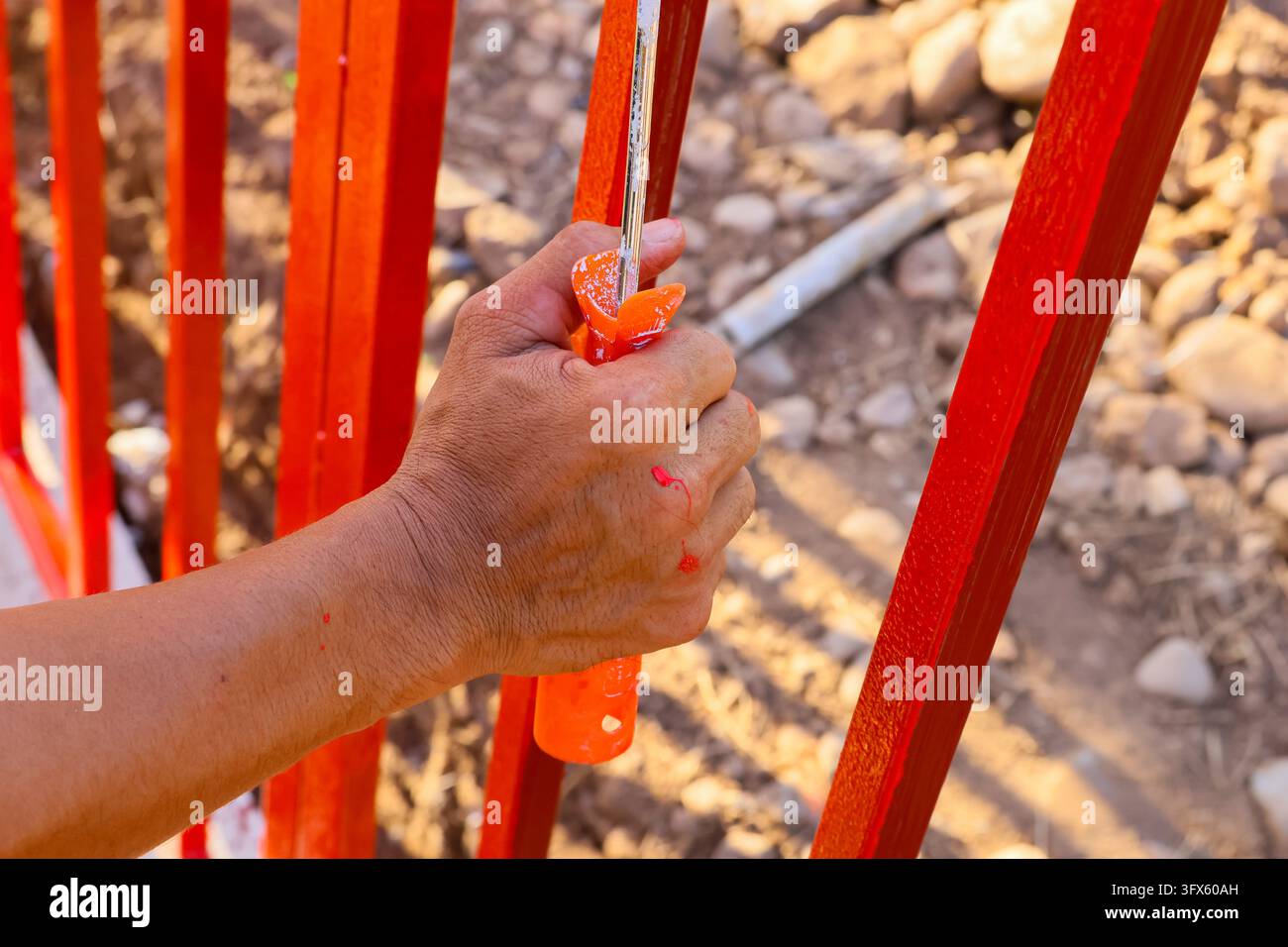 Use Hand Railing Signs A hand painting red metal railing in outdoor construction setting Stock ...