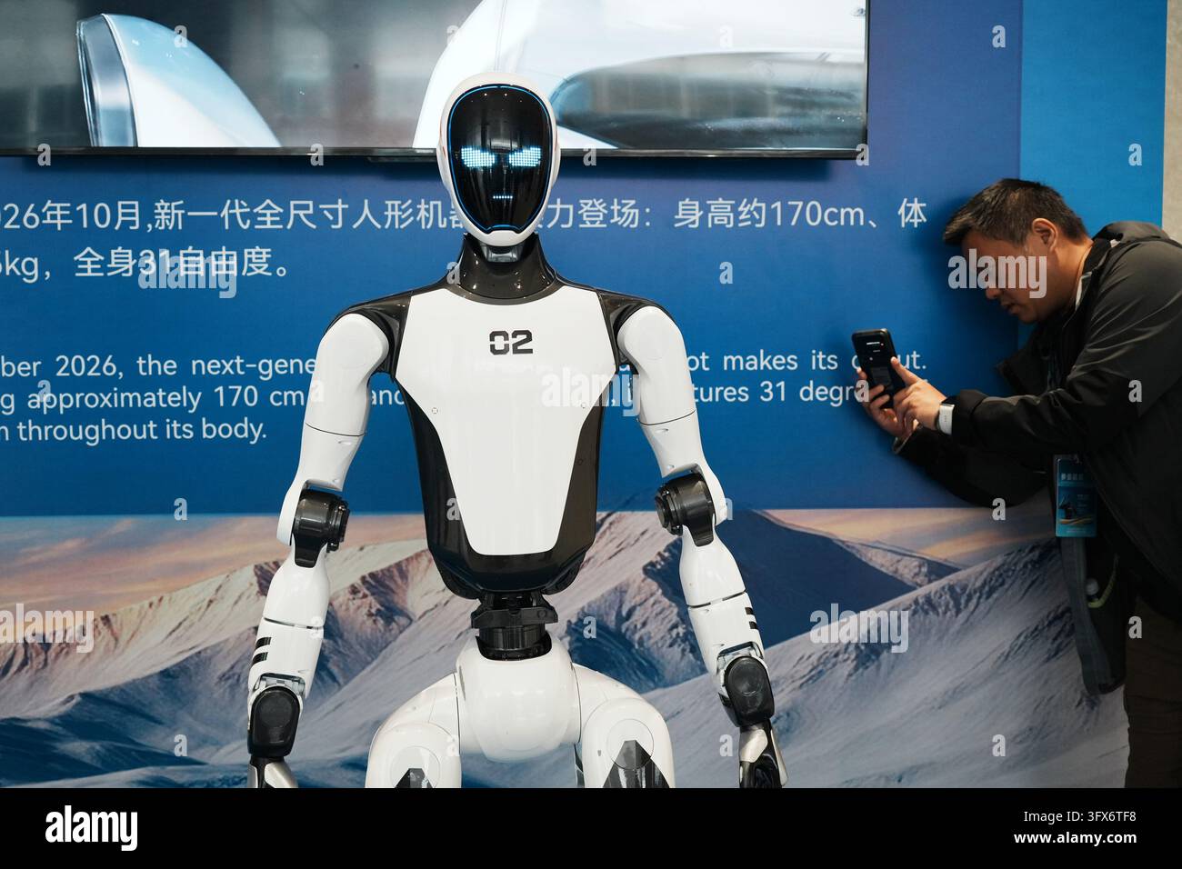 A viewer is watching Unitree's latest H2-X humanoid robot at the 2026 ...