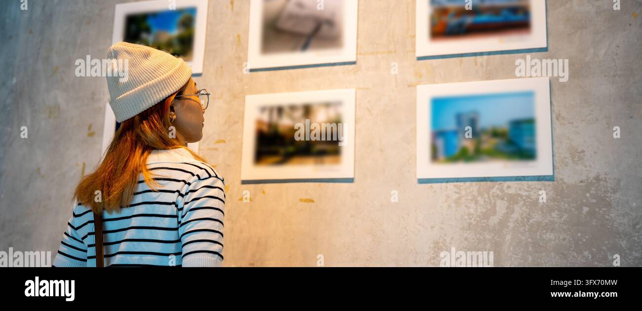 Picteures Asian woman standing she looking art gallery in front of colorful ...