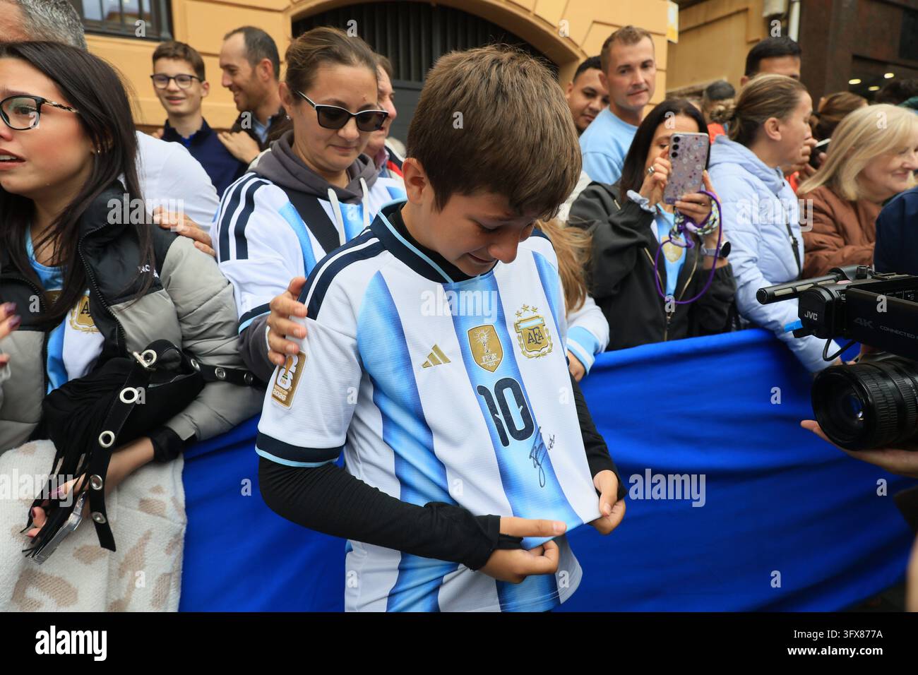 Messi fans crying after getting an autograph on their shirt, on October ...