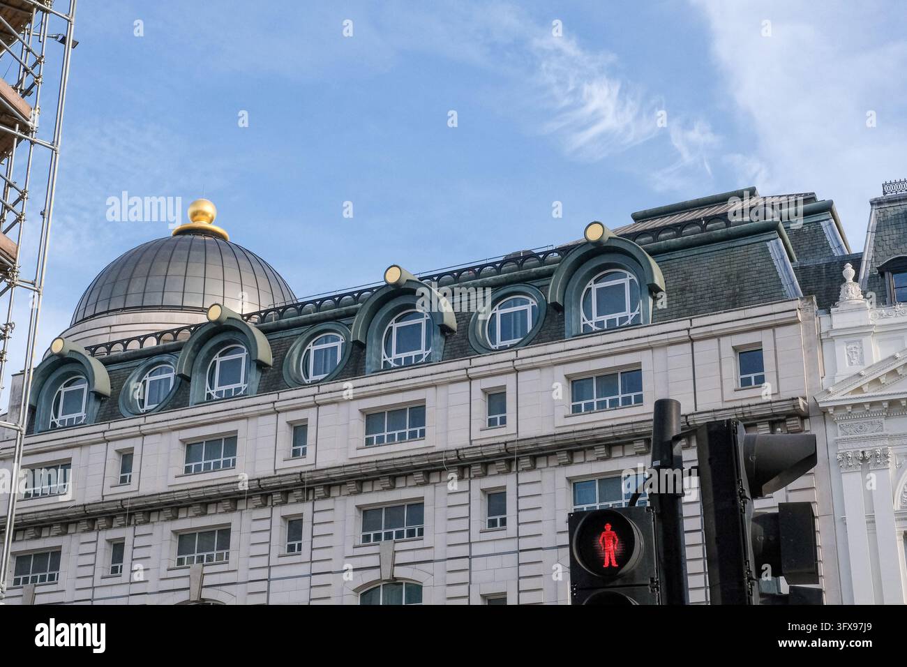 Historic London building with arched dormer windows, dark roof, domed ...