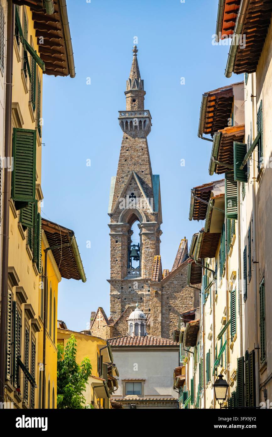View of a street with Church Santa Croce in Florence, tower, UNESCO ...