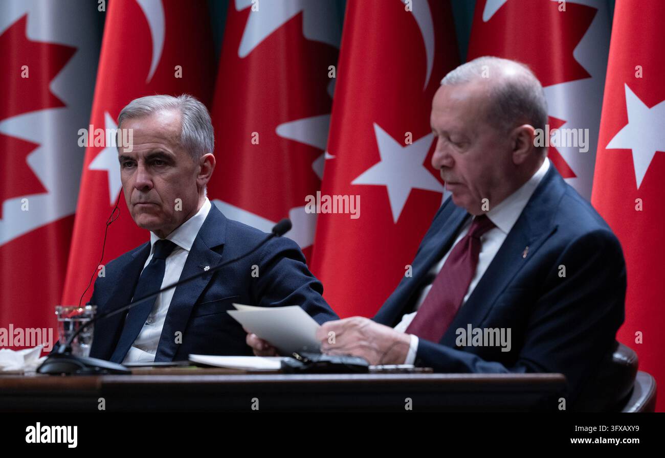 Prime Minister Mark Carney, left, looks on as Turkish President Recep ...