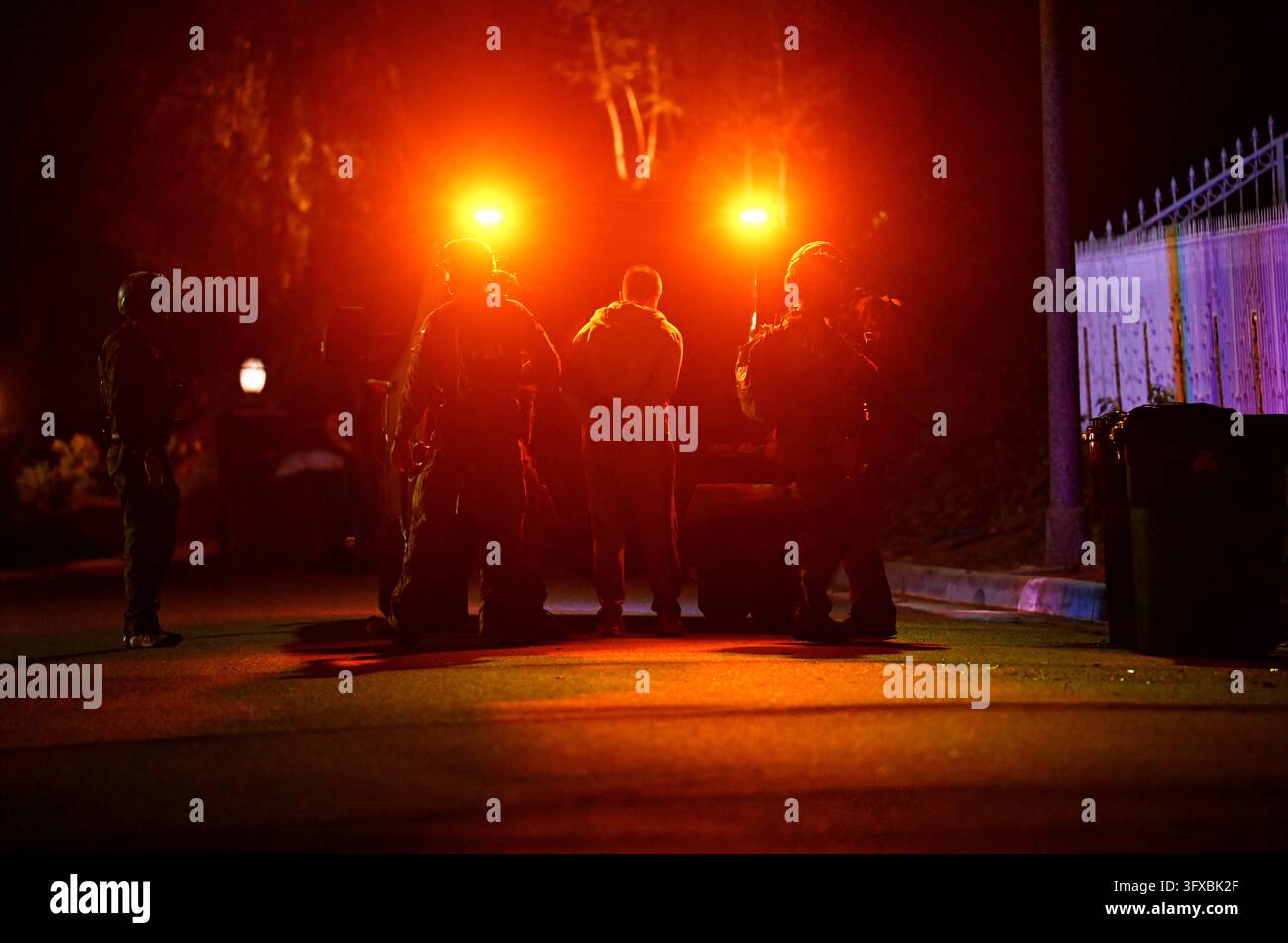 Federal agents arrest a suspect during a raid related to health care ...