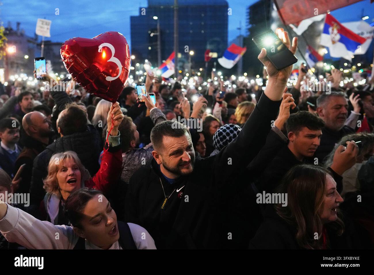 People flash the lights of their mobile phones during the final ...