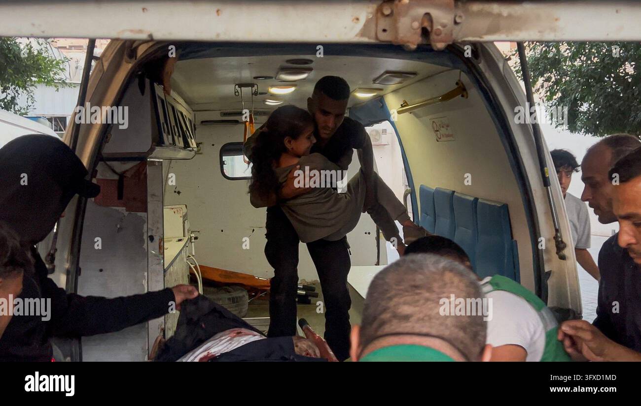 Men Lean Chest A Palestinian man holds a young girl against his chest inside an ...