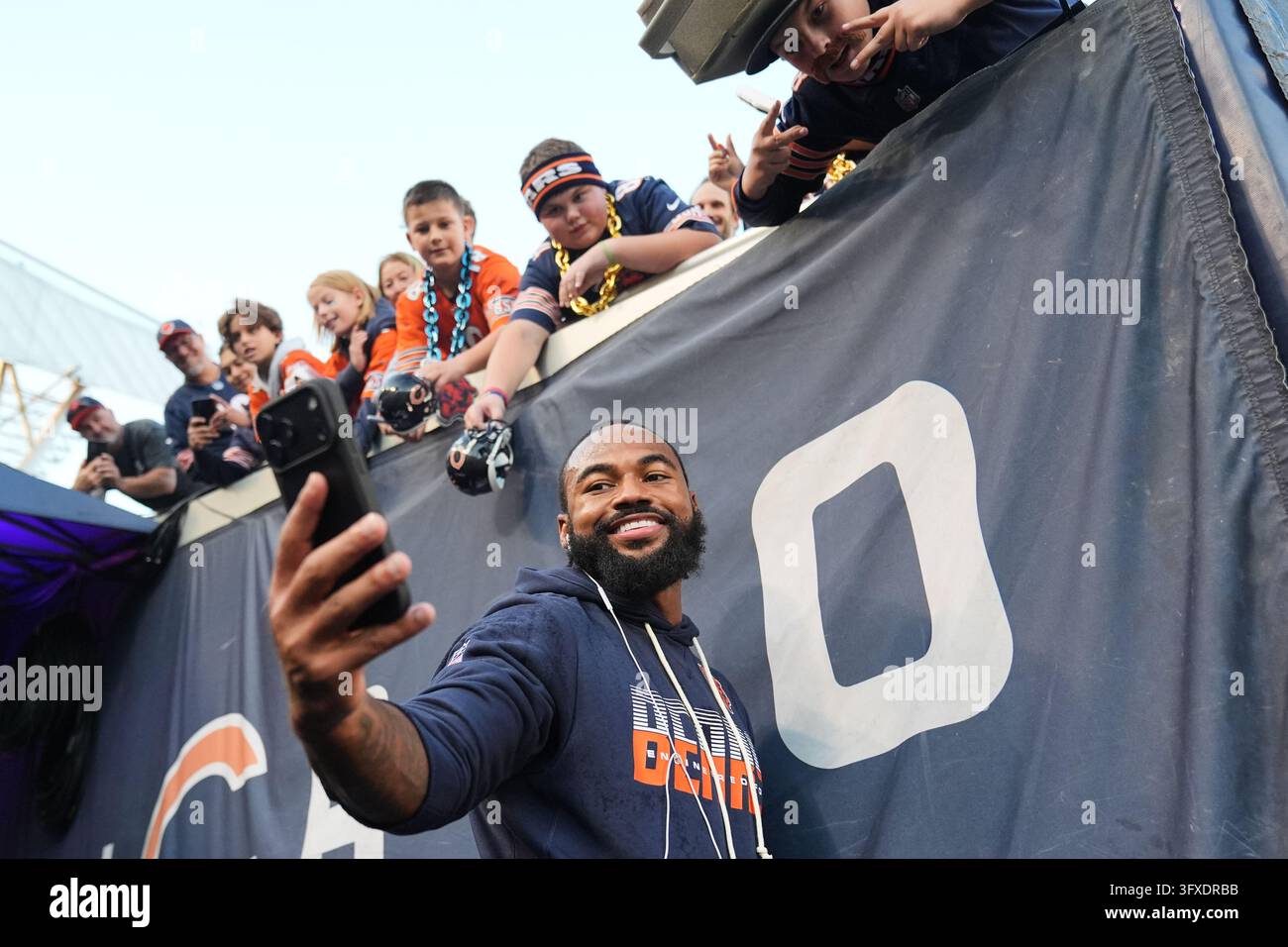 Chicago Bears running back D'Andre Swift takes a picture with fans ...