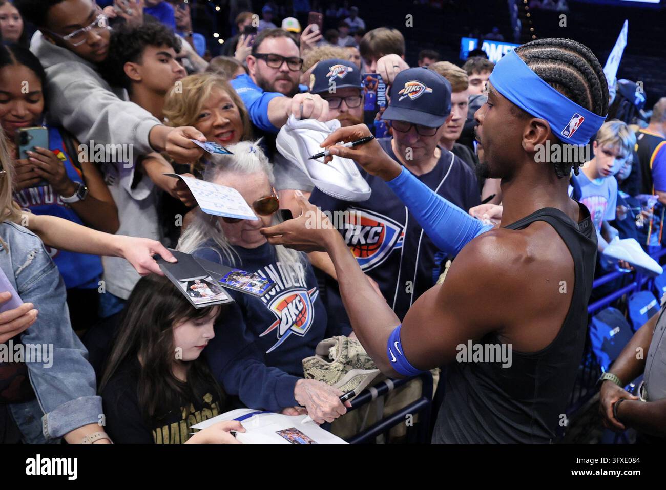 Thgunder Vector Oklahoma City Thunder guard Shai Gilgeous-Alexander, right, signs ...