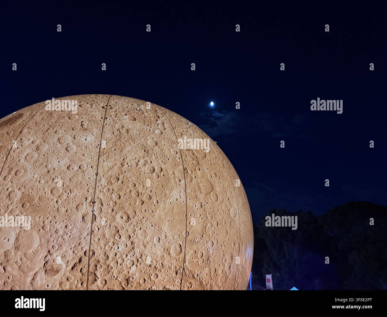 Close-up of a glowing moon art installation displayed at a limited-time festive event held in Maizuru Park, Fukuoka, Japan. - Smartphone Captured Stock Image