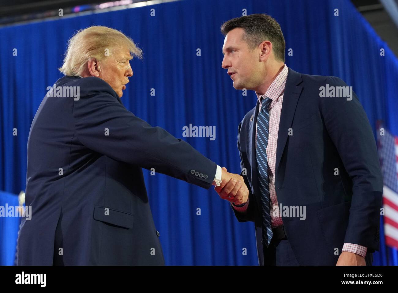 Trump Rally Iowa President Donald Trump shakes hands with Iowa gubernatorial candidate ...