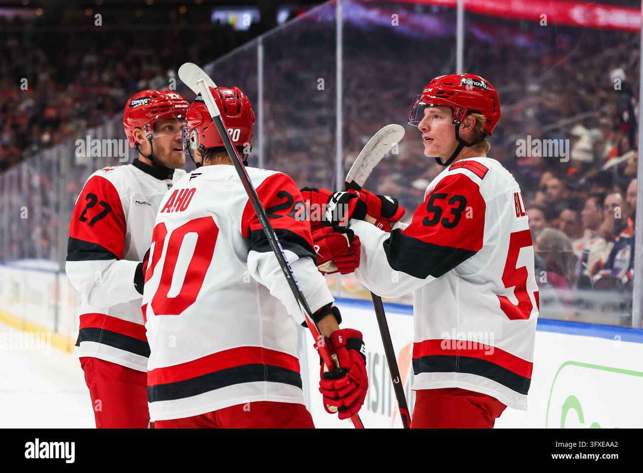 Carolina Hurricanes' Jackson Blake (53), Sebastian Aho (20) and Nikolaj ...