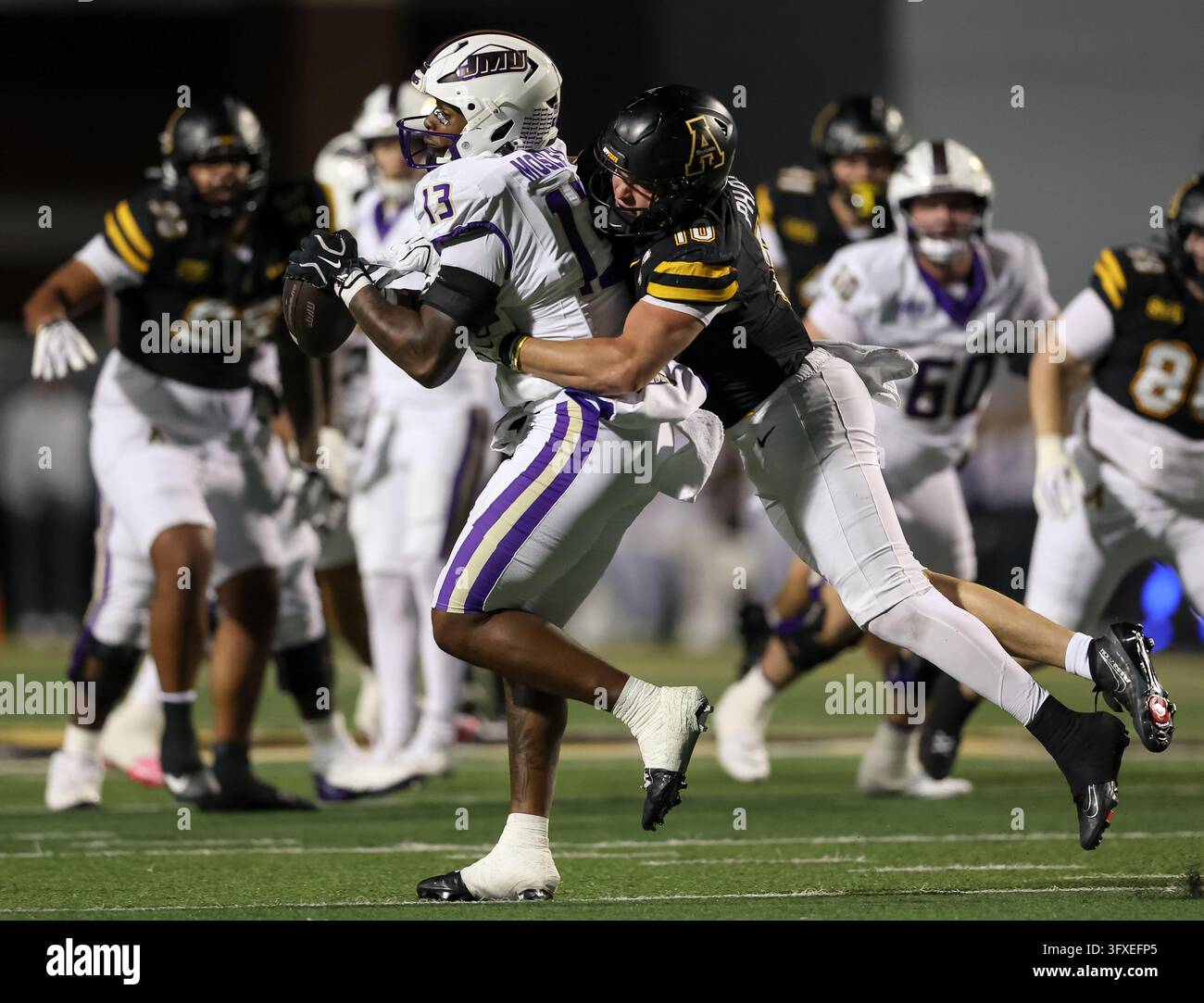 October 22, 2026: James Madison Dukes KD Mosley (13) is tackled by App ...