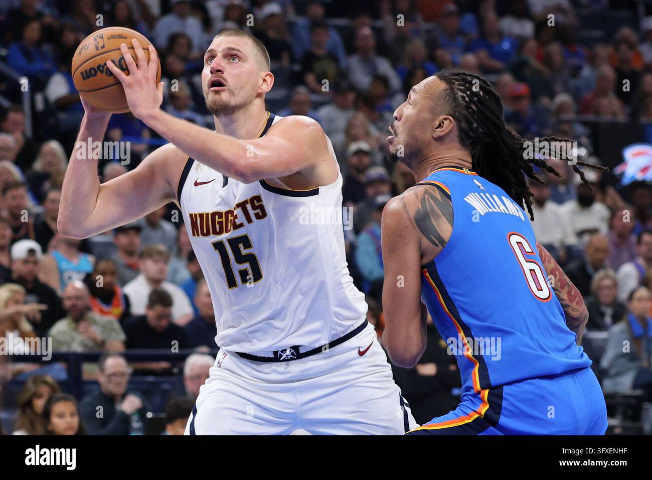 Thgunder Vector Denver Nuggets center Nikola Jokic (15) looks to shoot next to Oklahoma ...
