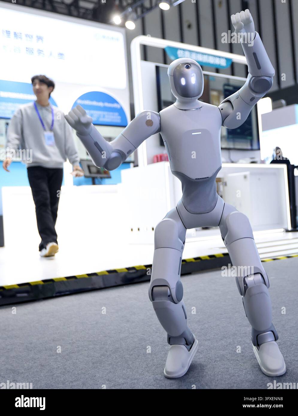The photo shows an embodied intelligence robot performing a dance ...