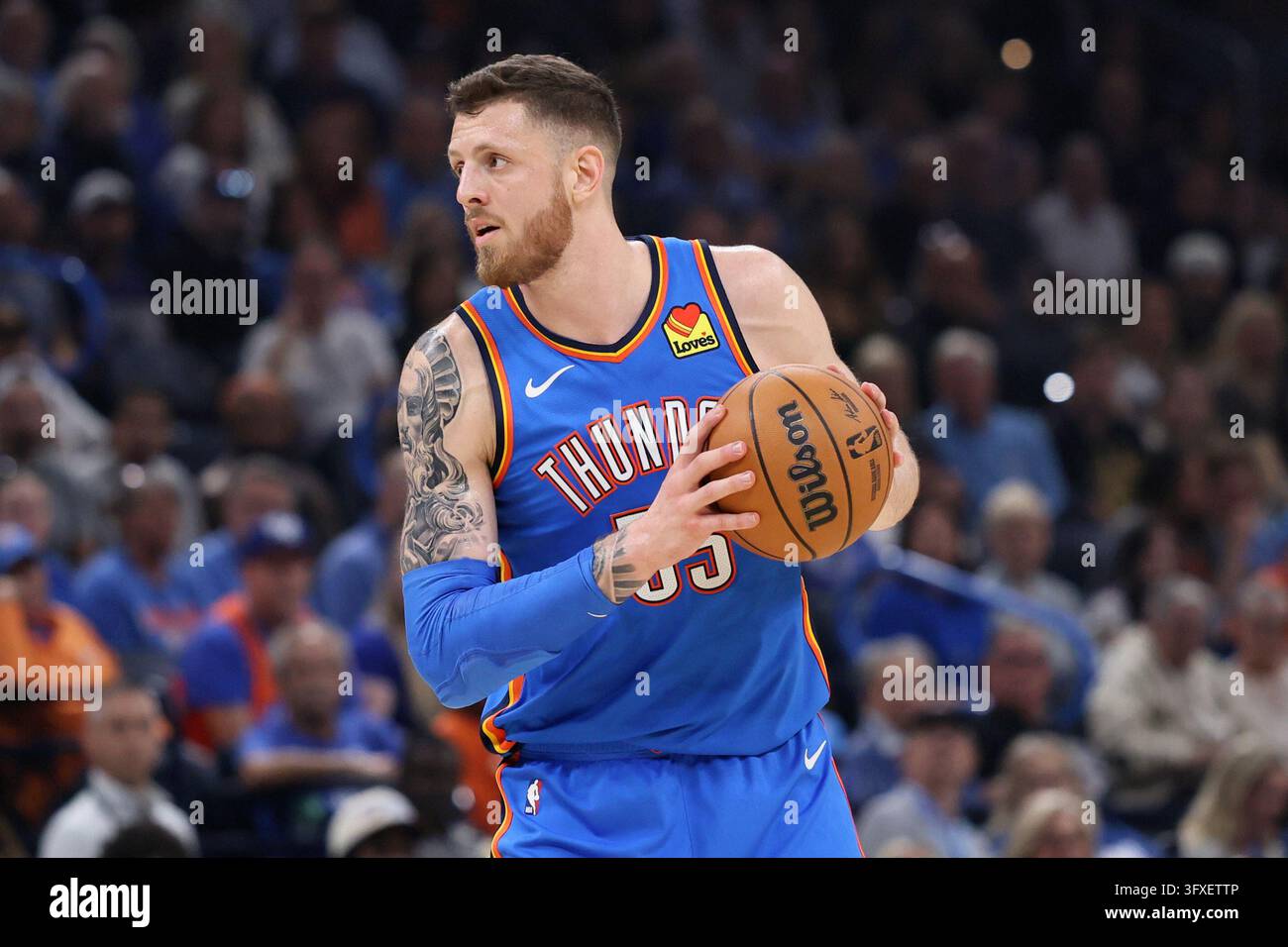 Thgunder Vector Oklahoma City Thunder center Isaiah Hartenstein holds the ball during ...