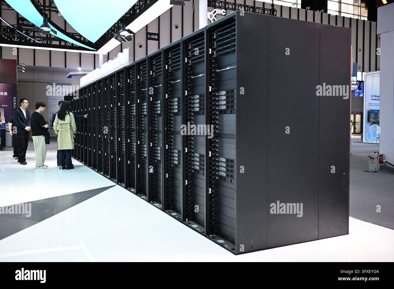 Visitors check an exhibition of Huawei's Atlas 950 SuperPoD at the 2026 ...
