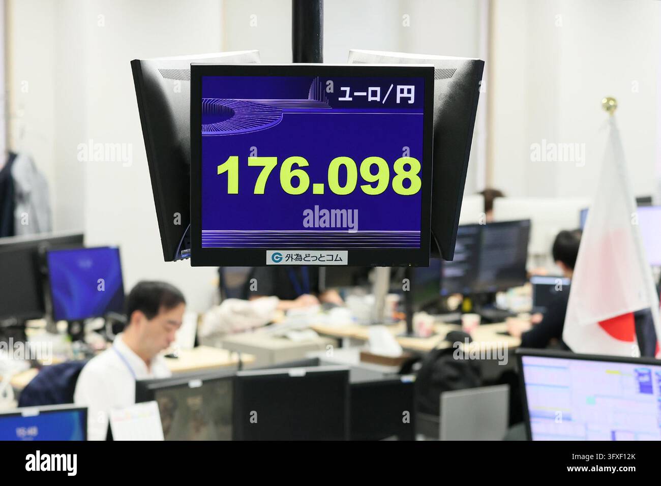 An electronic board displays the Japanese yen's exchange rate against ...