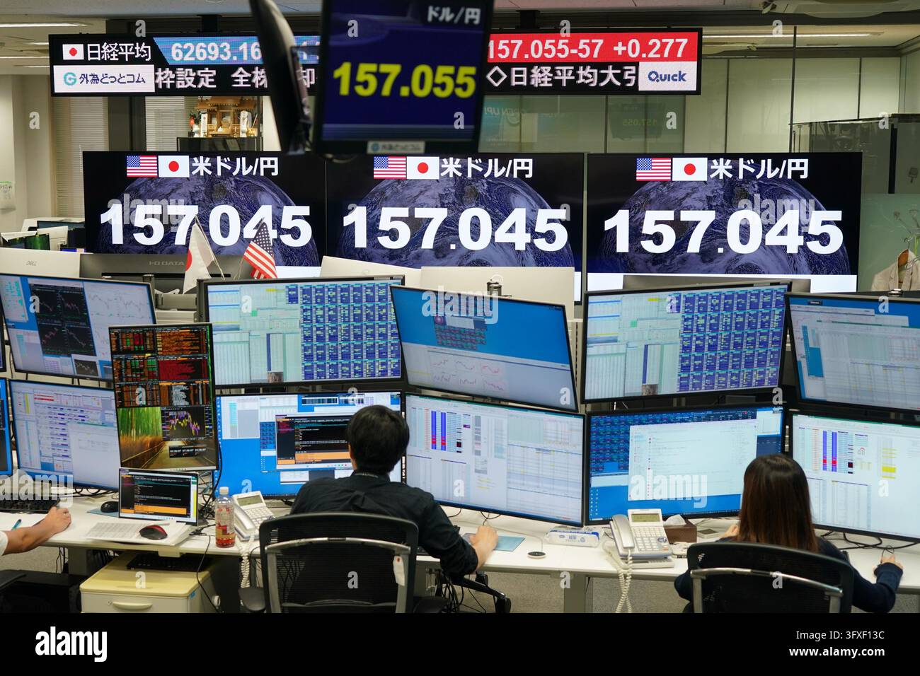 An electronic board displays the Japanese yen's exchange rate against ...