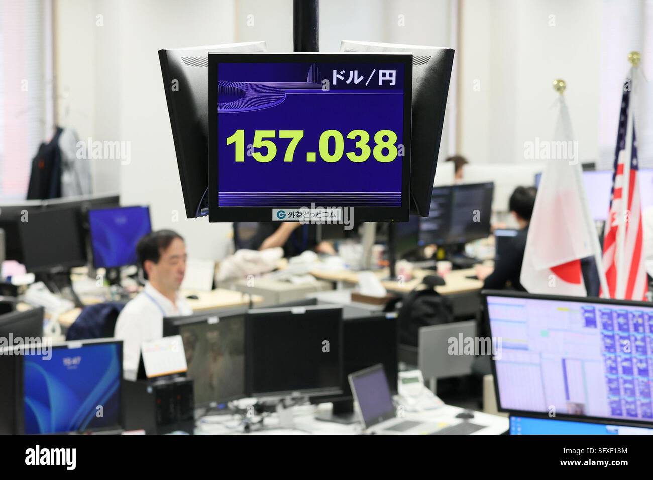 An electronic board displays the Japanese yen's exchange rate against ...